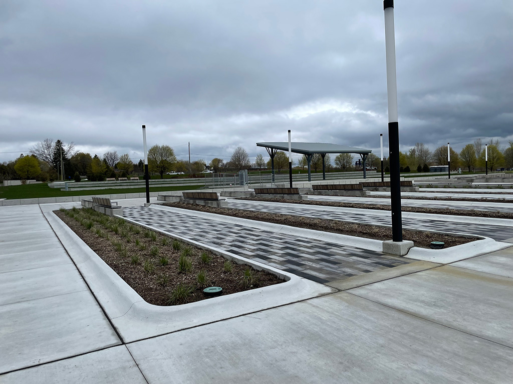 A garden bed in the Garden of Human Rights with plants freshly sprouting from the ground.