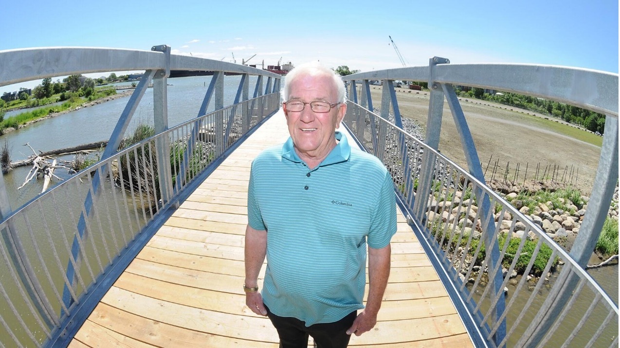 A man on the Larry Ladd bridge.