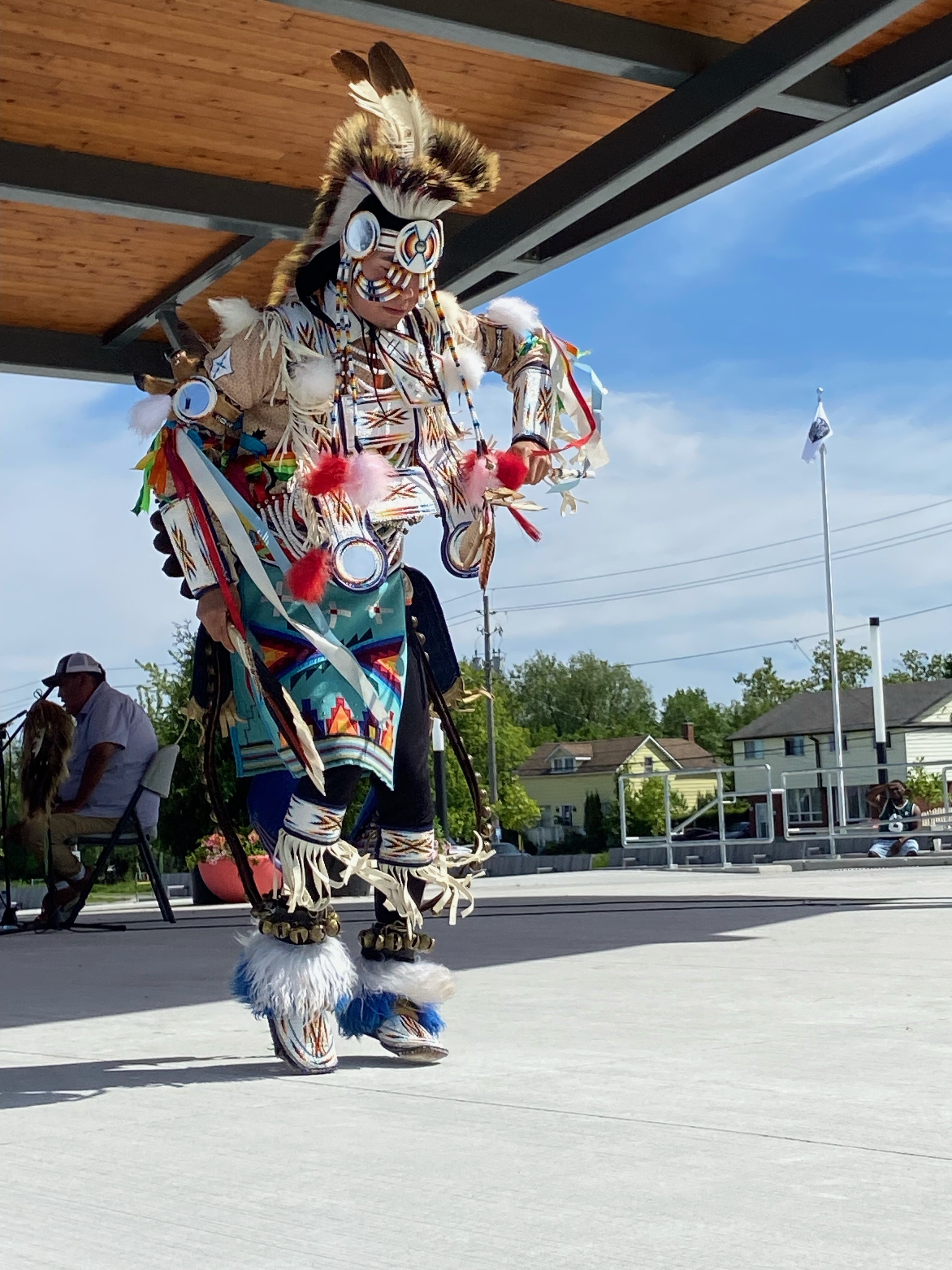 An indigenous performer in full regalia.